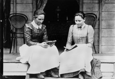 statelibqld_1_132733_two_women_reading_on_a_verandah_at_ingham_ca-_1894-1903